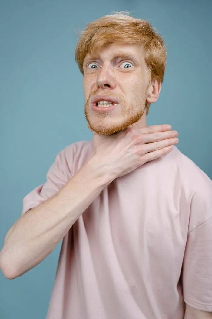 A man gesturing choking, highlighting facts that could make a difference in an emergency