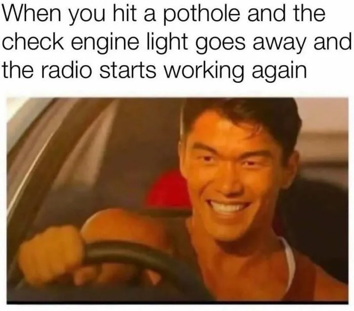 A smiling driver at the steering wheel representing edgy and hilarious memes about car problems