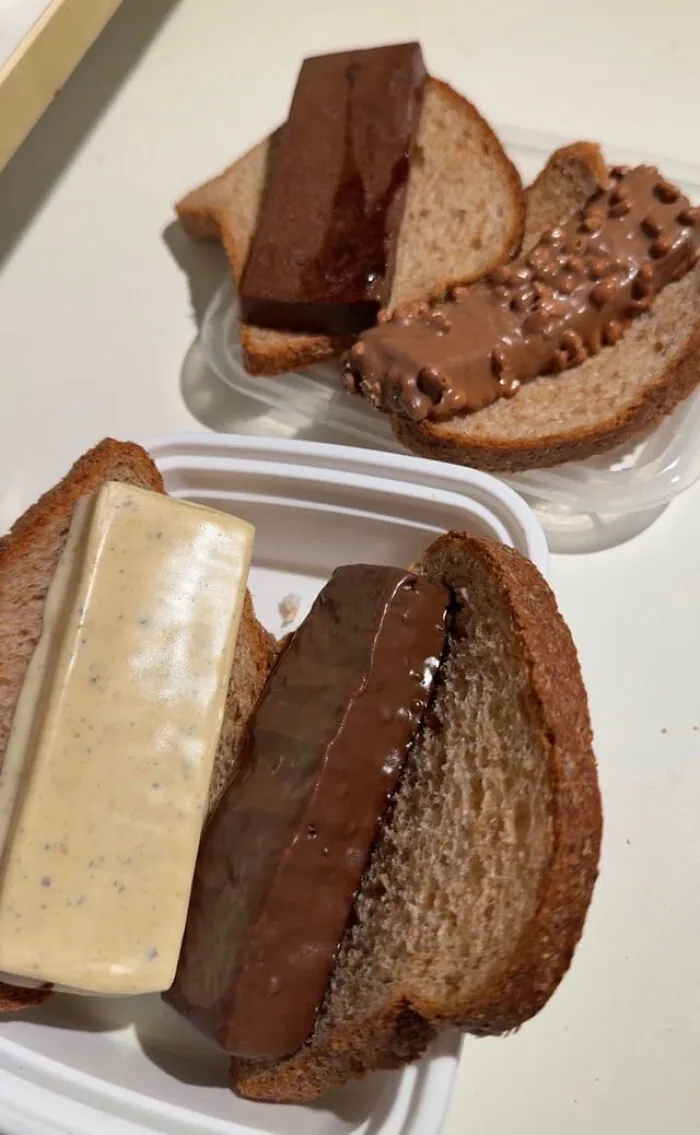 Weird food combinations of thick chocolate and protein bars served as fillings in sliced bread sandwiches