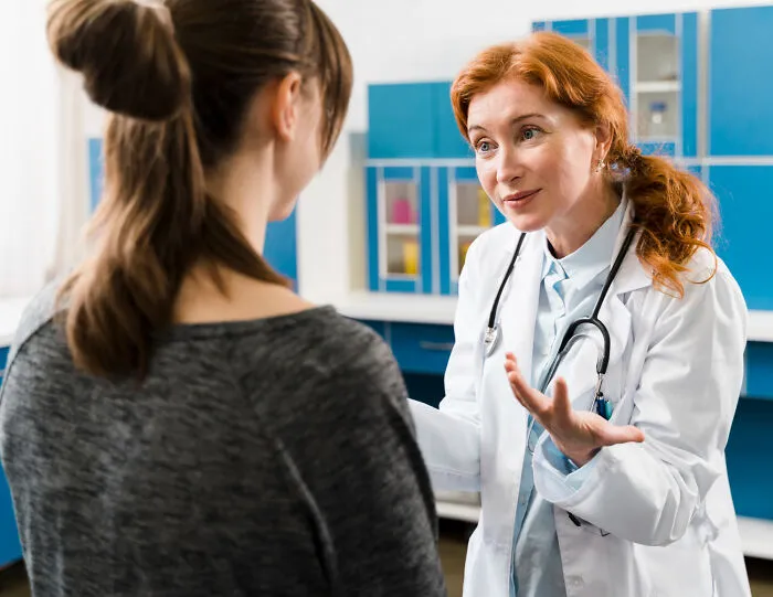 A doctor explaining a situation to a patient, discussing real reasons marriages collapsed