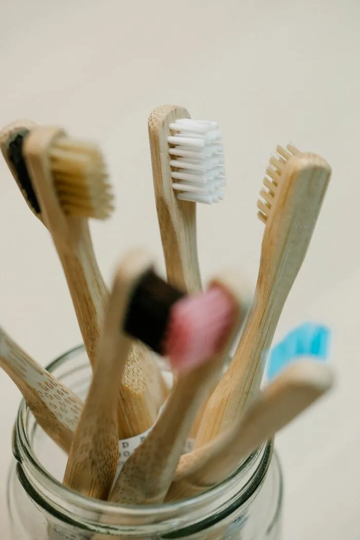 Jar filled with eco-friendly bamboo toothbrushes handed out instead of candy