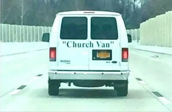 A white van driving on the road with misused quotation marks around Church Van on the back.