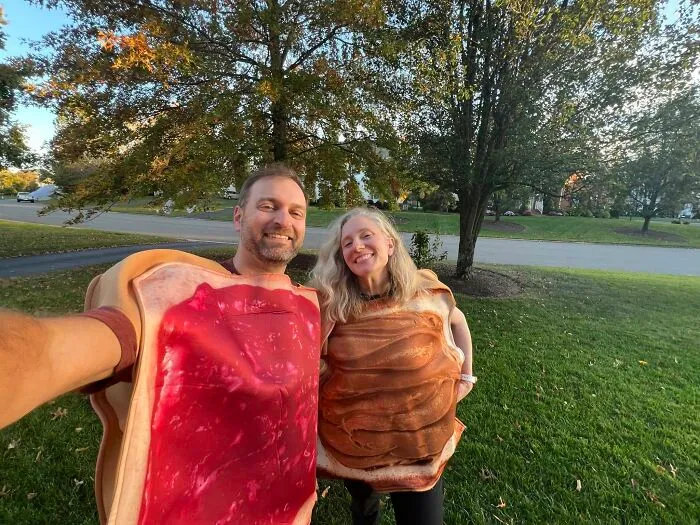 A couple wearing peanut butter and jelly toast outfits for low-effort Halloween costumes outdoors.