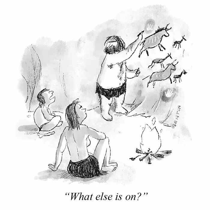 Black and white comic showing cavemen watching cave paintings like a television screen.