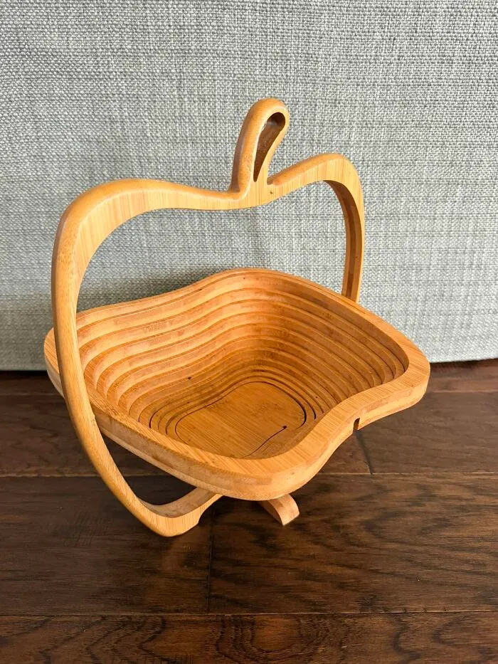 Wooden apple-shaped collapsible basket thrift store find on floor