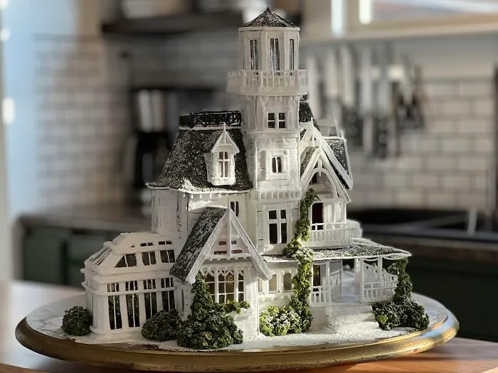 Intricate haunted victorian house gingerbread cake made as creative Halloween foods for a party centerpiece.