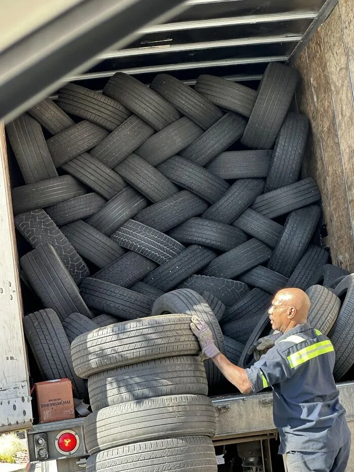 Interesting and cool pics of a truck meticulously packed with tires in a braided pattern