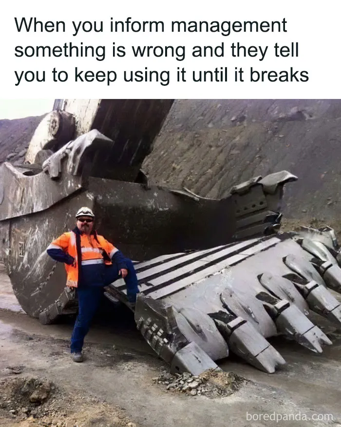 Funny cringe construction fail meme of a worker posing beside a massive excavator bucket