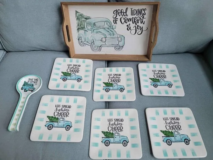 Holiday themed thrift store serving tray and matching plates with festive truck design
