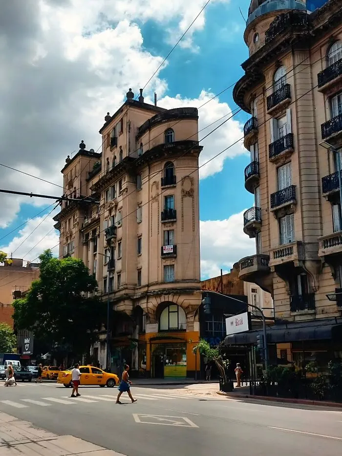 Thin historical buildings with bizarre shapes viewed from a street corner in the city