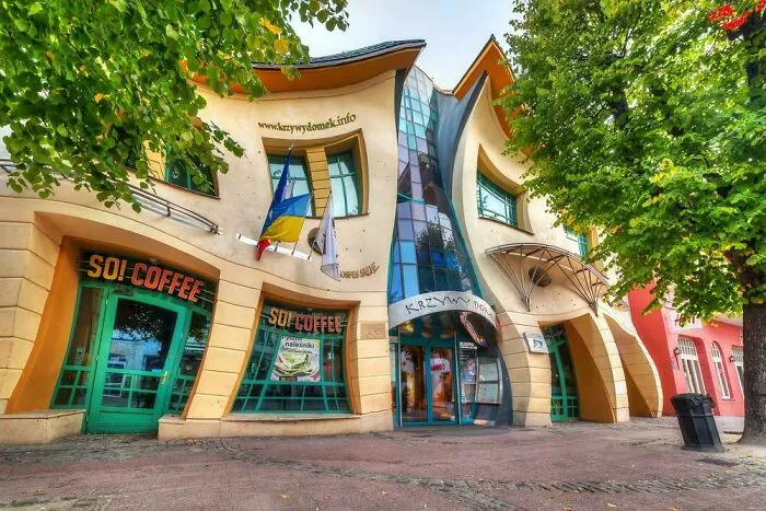 The Krzywy Domek Crooked House with its bizarre shape stands in Poland.