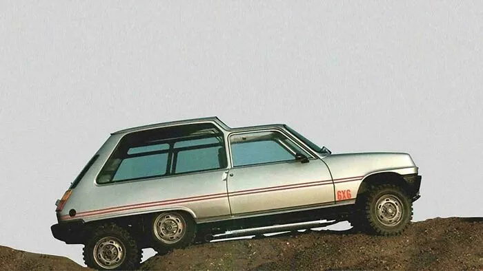 Side view of a vintage silver six-wheeled hatchback car driving on dirt, an example of wonderful vehicles.