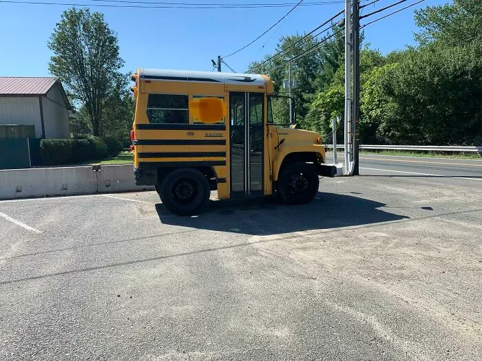 Extremely short yellow school bus modified into a tiny two-wheeled size, representing weird vehicles.
