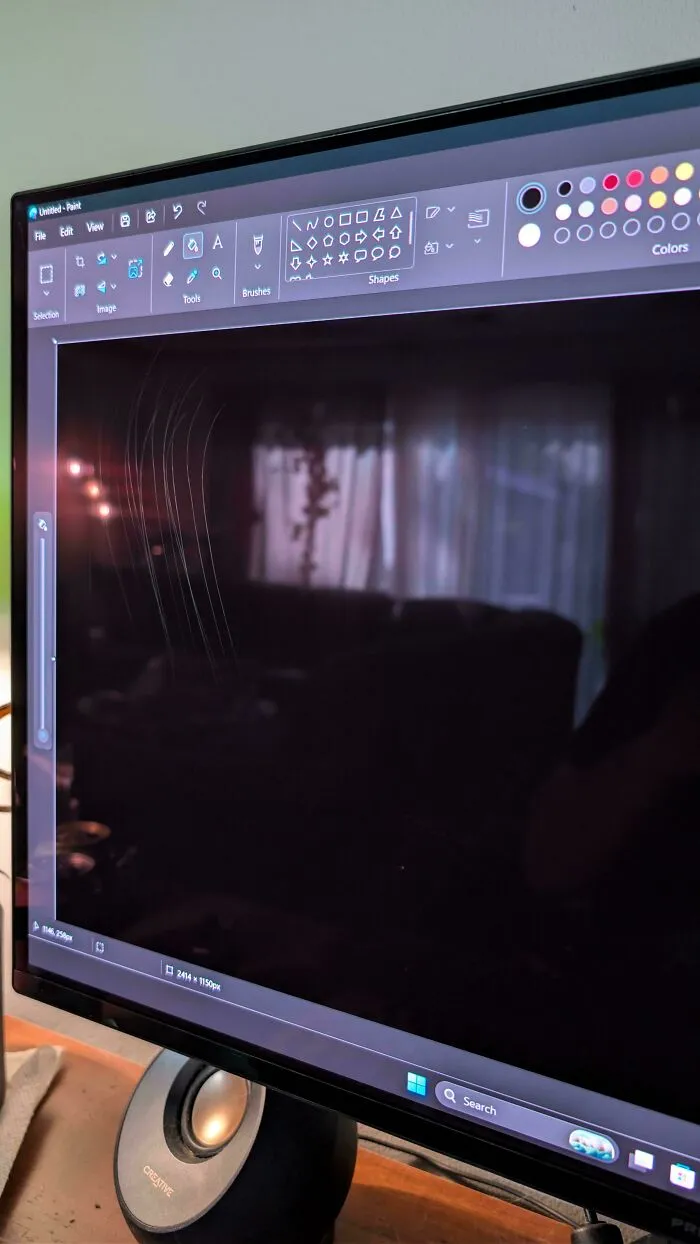 Scratch marks visible on a computer monitor screen, an example of when things went wrong with technology