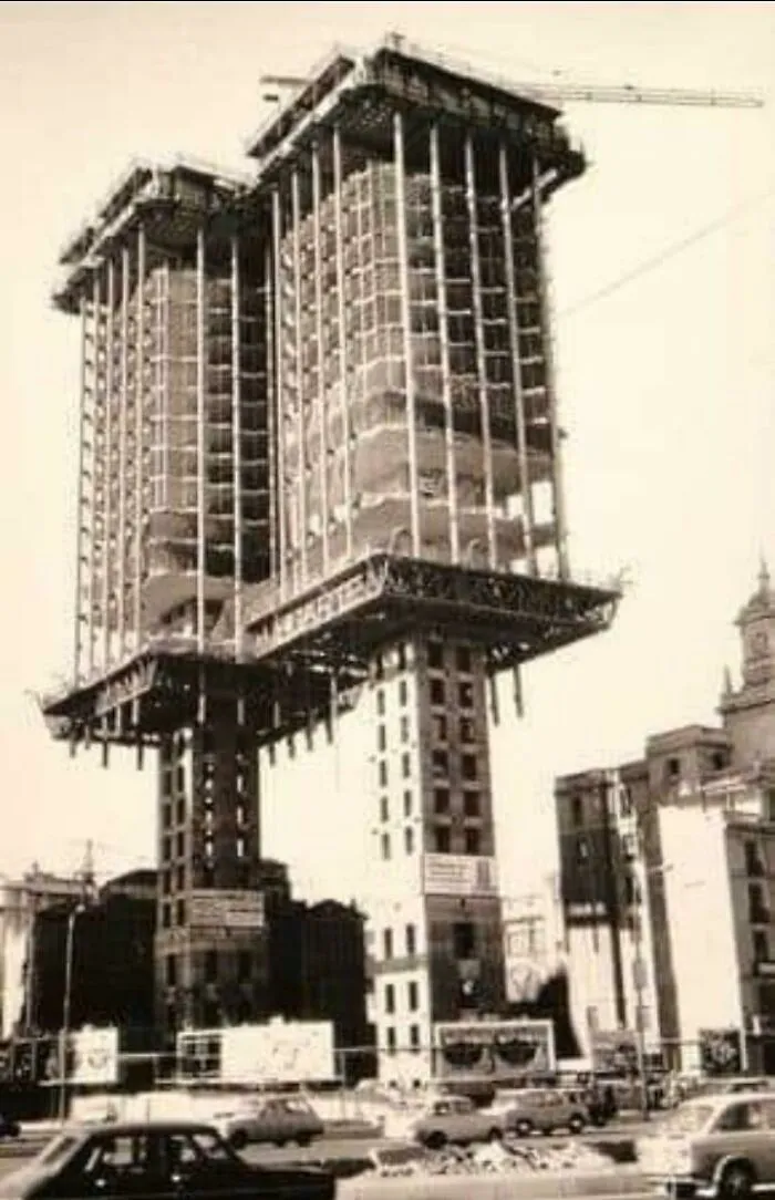 Vintage photo of towers constructed from top to bottom, showing how buildings turn heads with bizarre shapes