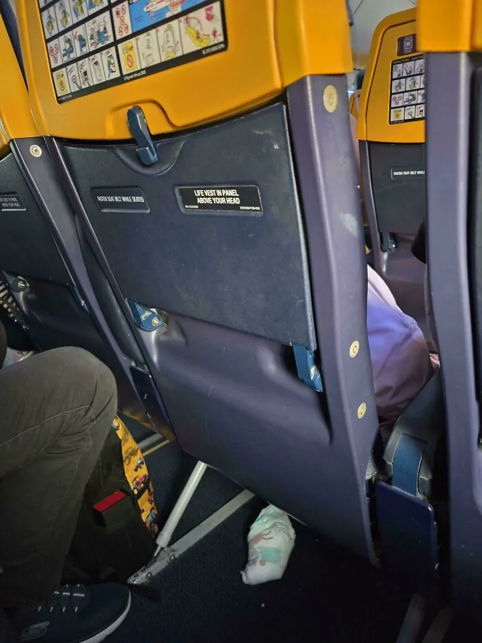 A discarded baby diaper on an airplane floor showing things went wrong.