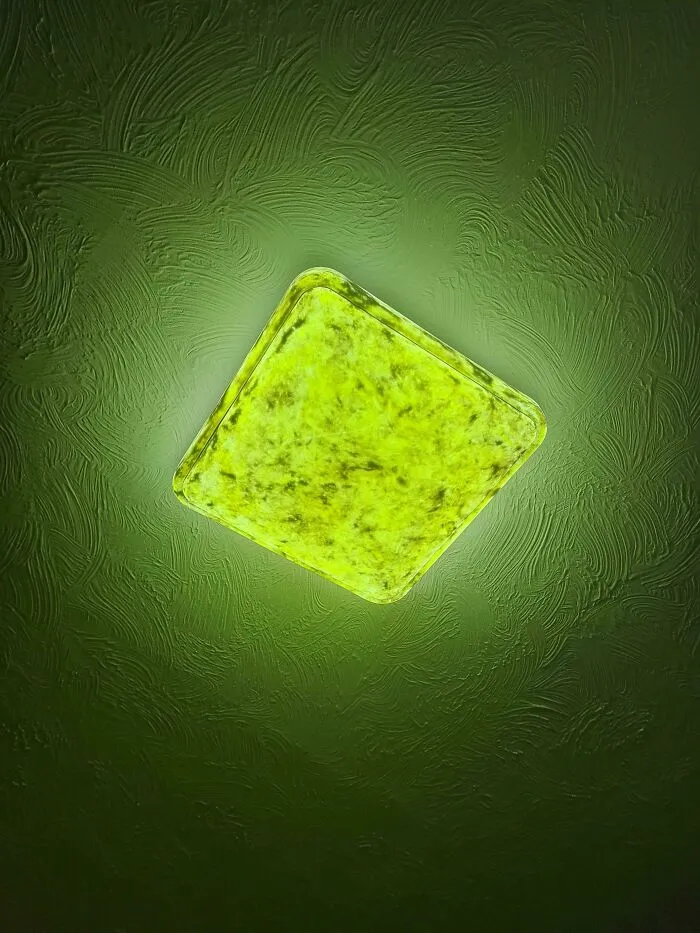 A unique DIY project showcasing a glowing green ceiling light fixture resembling a slice of lime.