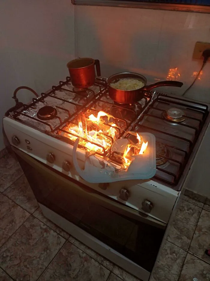 A plastic cutting board melting and catching fire on a hot stove. Things Went Wrong Pics