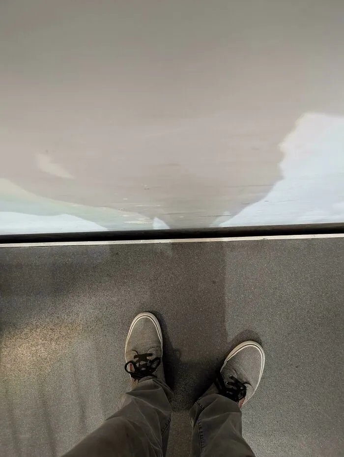 Looking down at shoes on a train platform where things went wrong