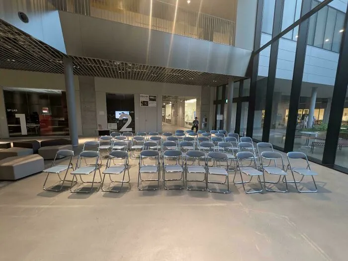 An empty room set up for a presentation where things went wrong with attendee turn out