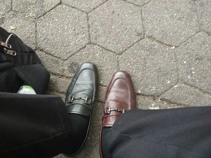 A person wearing mismatched black and brown leather shoes. Things Went Wrong Pics