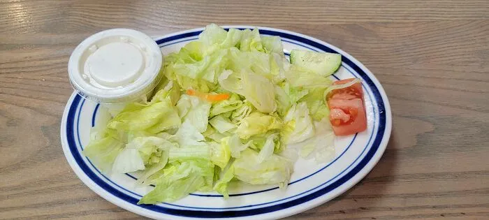 A sad side salad with minimal ingredients representing things went wrong