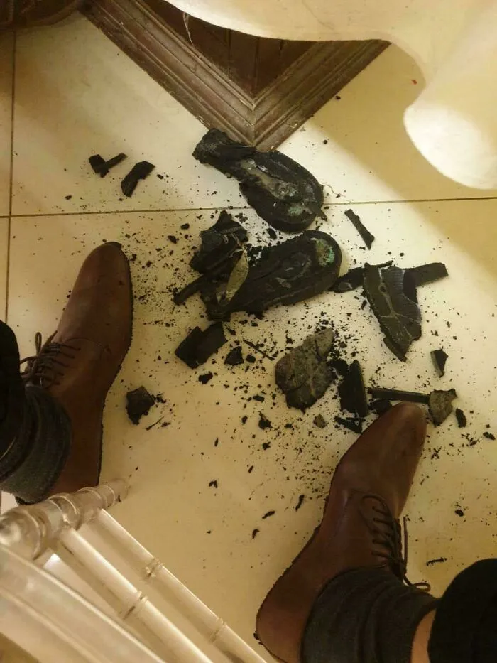Crumbled and destroyed shoe sole on floor shows things went wrong pics