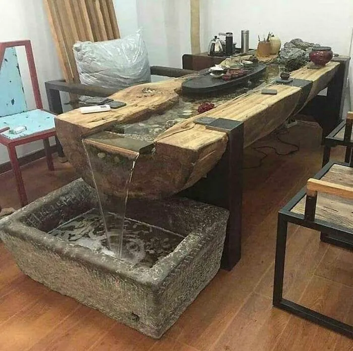 Rustic wooden river table with a built-in running water fountain DIY projects