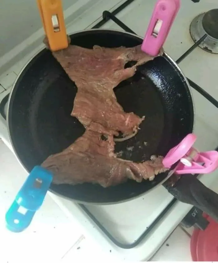 Weird kitchen DIY projects featuring a slice of meat held in a frying pan using colorful clothespins