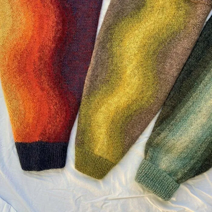 Three colorful knitted sweater sleeves with gradient patterns hand-made by knitting amateurs and pros