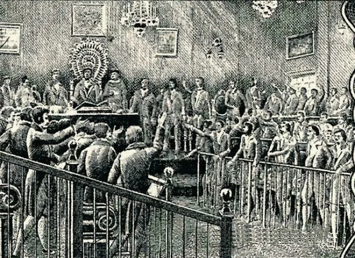 Engraving of a crowded 19th-century assembly room, illustrating historical treasures from 200 years ago.