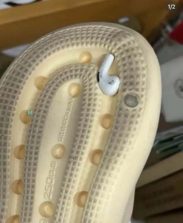 An earbud wedged firmly in the sole of a shoe, representing when things went wrong