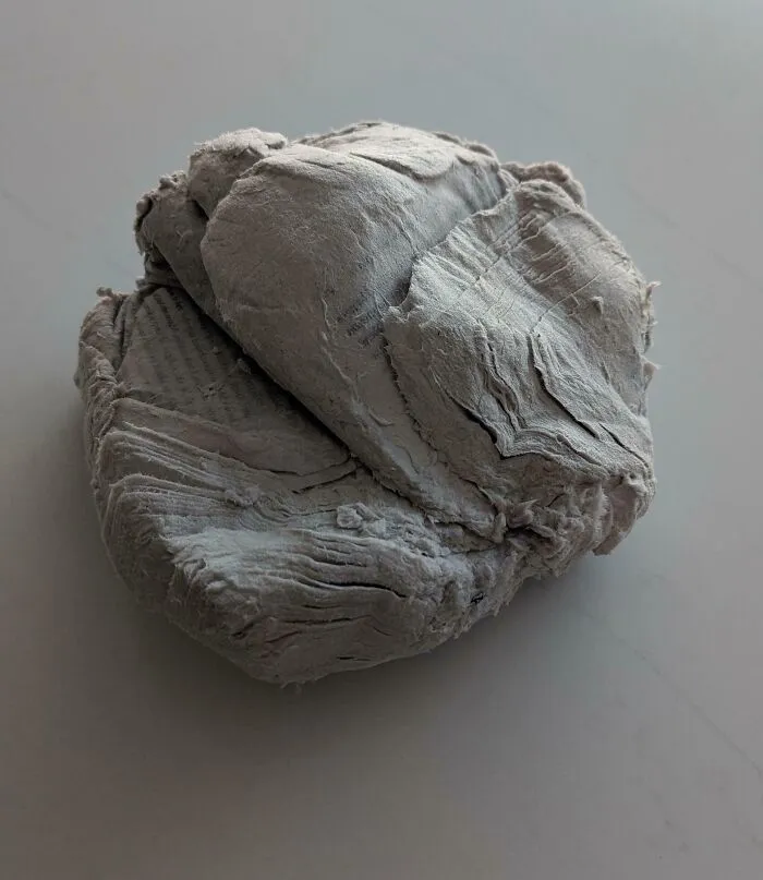 A tightly compressed block of gray recycled paper, fitting the theme of things went wrong pics.