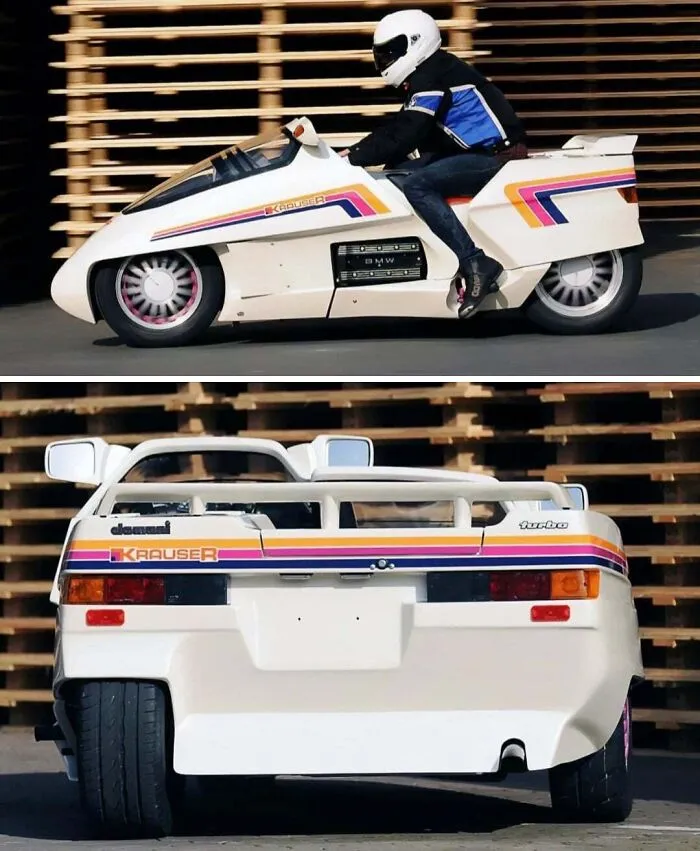 Side and rear view of a white, futuristic Krauser vehicle with colorful retro stripes.