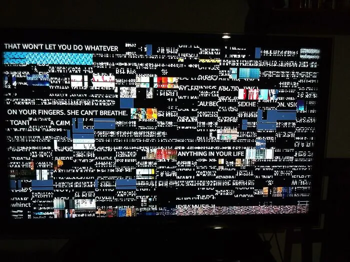 A television screen displaying garbled text and digital distortion, depicting creepy mysteries.