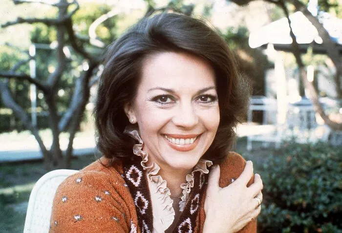 Portrait of actress Natalie Wood smiling outdoors, whose mysterious death is one of web's creepy mysteries.