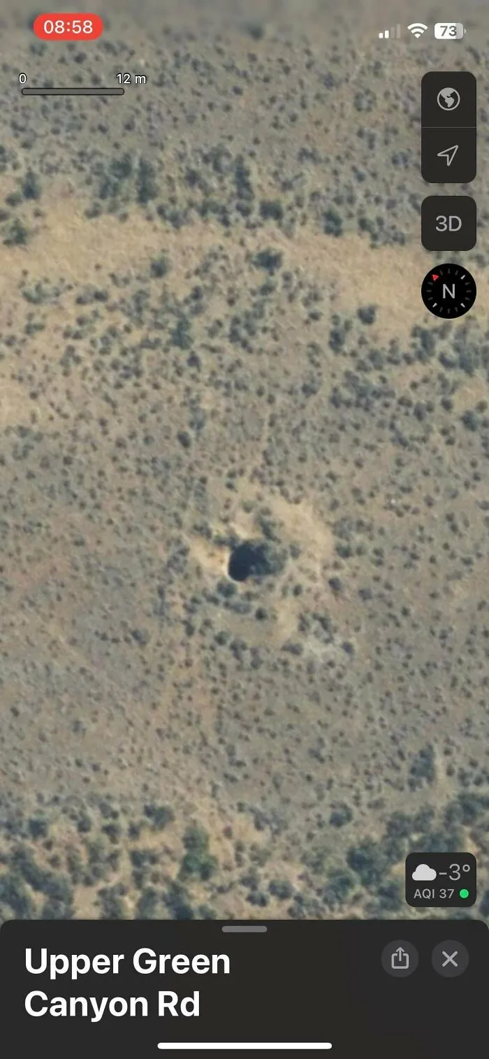 Aerial satellite map view of Upper Green Canyon Rd showing a terrain anomaly involved in creepy mysteries.