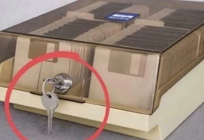 Vintage floppy disk storage box with key, nostalgic images evoking 90s kids memories
