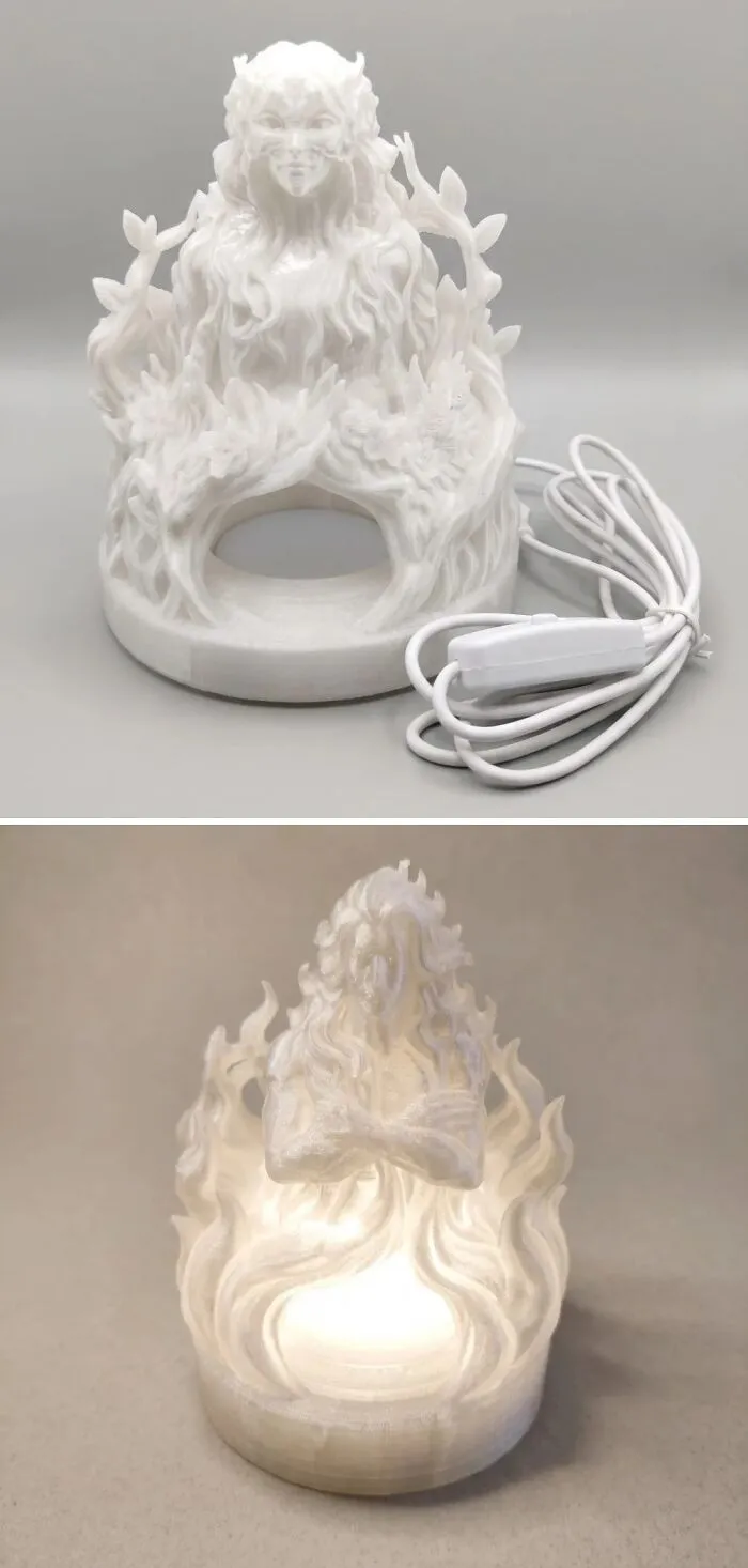 Intricate white 3D prints of female figures on lamp bases
