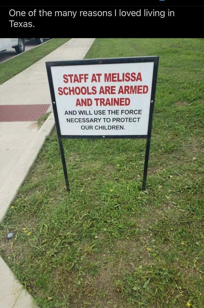 An armed staff sign outside a school in Texas reflecting modern life in America.