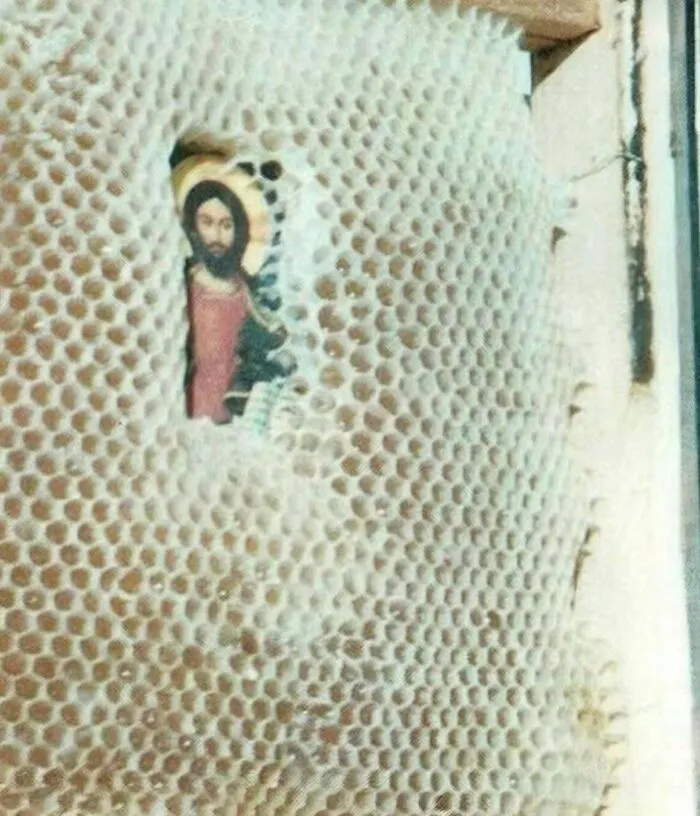 A religious image framed inside an intricate honeycomb structure, evoking creepy mysteries from around the web.