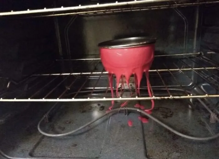 A melted plastic bowl dripping onto the rack inside an oven, capturing disastrous roommate stories