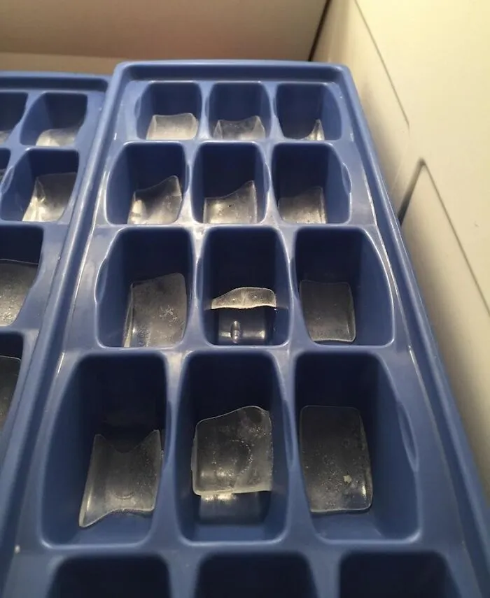 An ice cube tray filled with tiny slivers of ice, showing frustrating roommate stories.