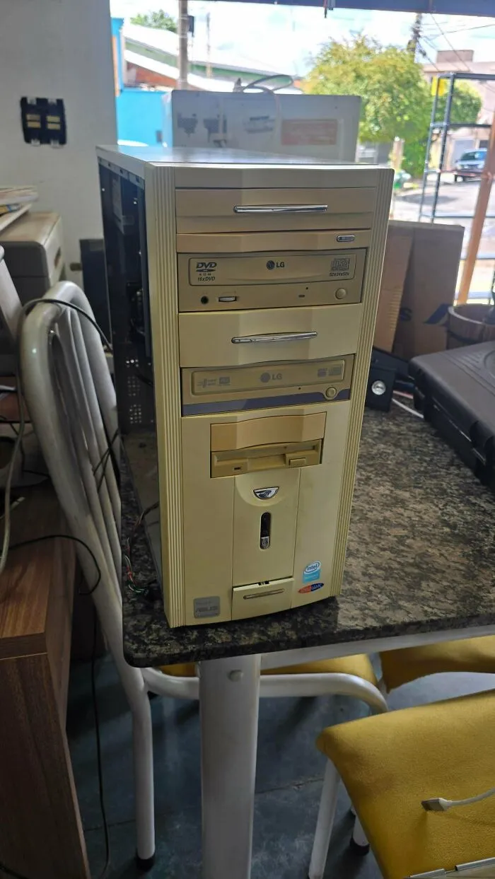 An old beige desktop computer tower with LG DVD drives, illustrating vintage tech finds