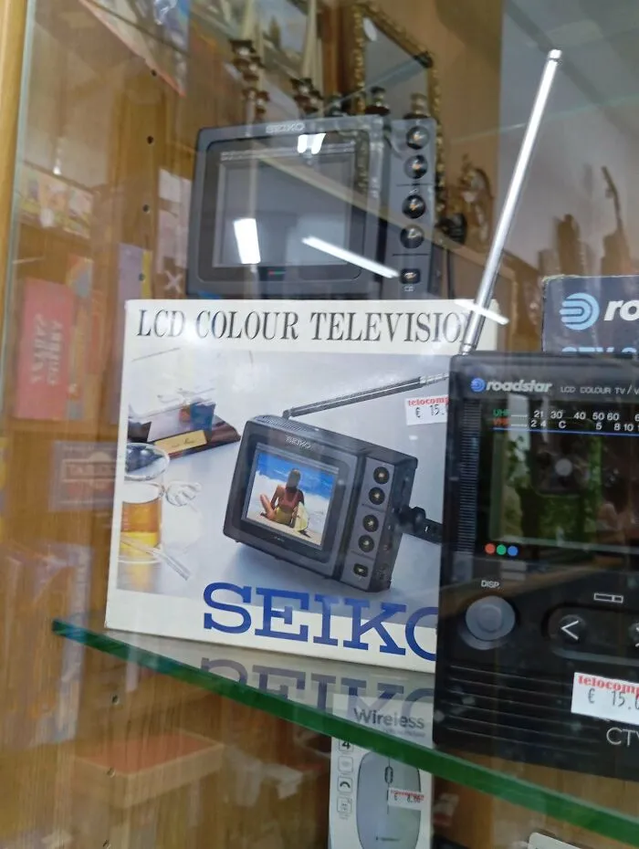 A boxed Seiko LCD color television displayed on a shelf, showcasing vintage tech and retro pocket TVs.