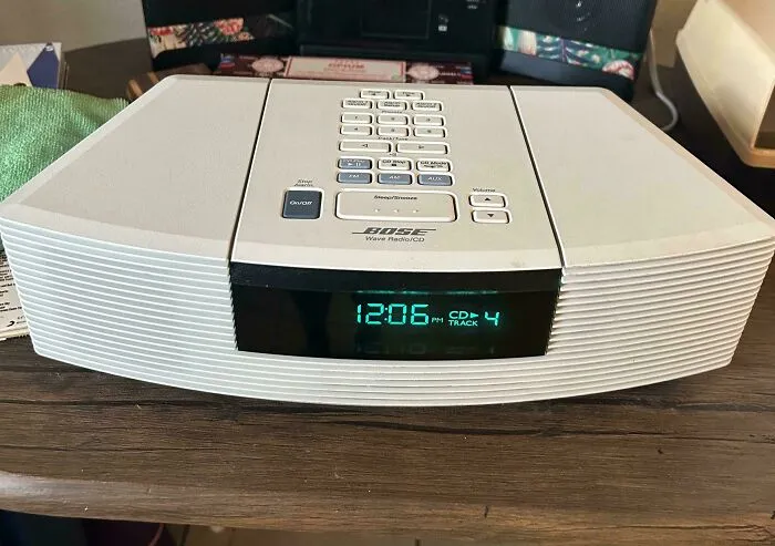 A white Bose Wave Radio CD player showing 12 06 as a vintage tech find