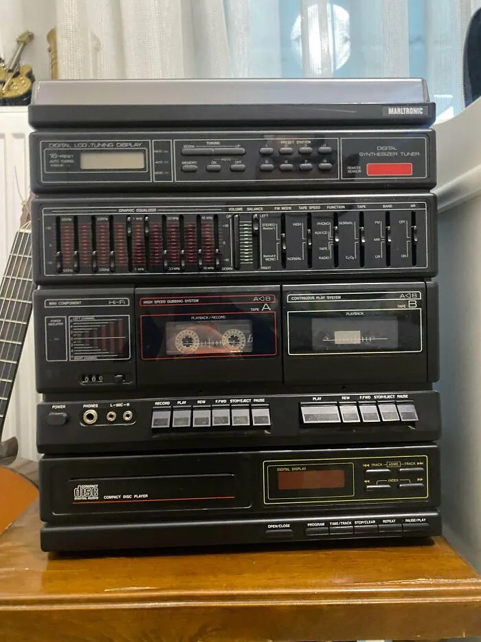 A black Marltronic cassette player system representing classic vintage tech