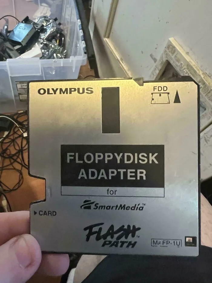 An Olympus floppy disk adapter for SmartMedia representing vintage tech finds