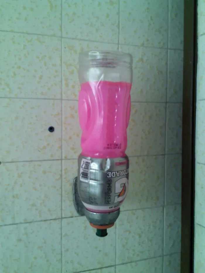A plastic Gatorade bottle wall dispenser as one of many funny redneck fixes