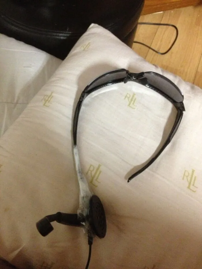 Sunglasses taped to a telephone headset as clever redneck fixes